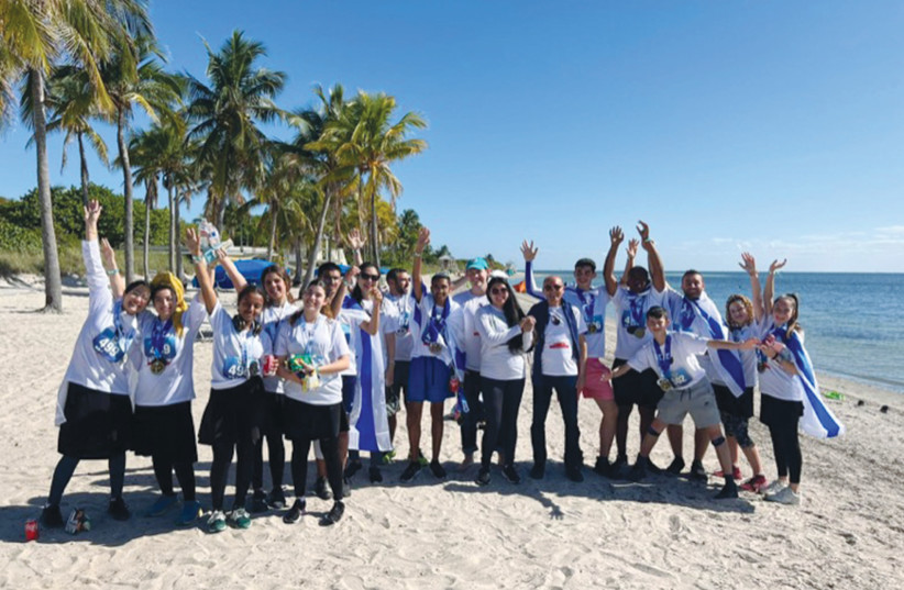  THE CHILDREN and counselors gather on the beach before the marathon. (photo credit: Cherut Frenkel)