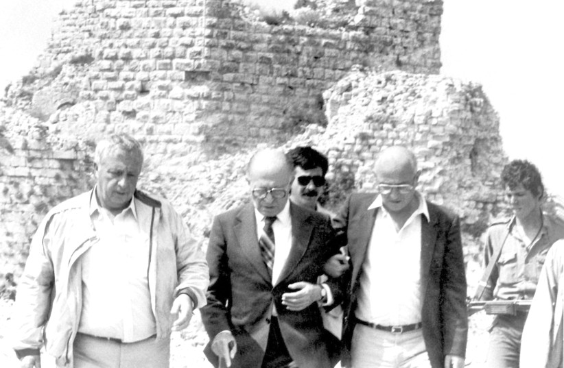  DEFENSE MINISTER Ariel Sharon walks with prime minister Menachem Begin and his spokesman on June 7, 1982, in Lebanon. (photo credit: Uzi Keren/GPO/Getty Images)