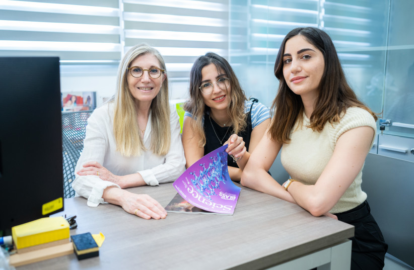  L-R: Prof. Jackie Schiller, Shay Achvat and Yara Otor, holding the Science issue in which their paper was published. (credit: NITZAN ZOHAR/TECHNION SPOKESPERSON'S OFFICE)