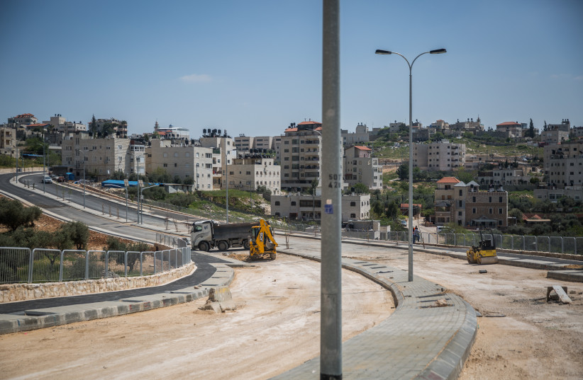  View of construction of a new road and sidewalks in the East Jerusalem neighborhood of Shuafat (credit: HADAS PARUSH/FLASH90)