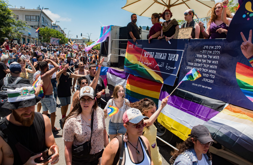  People march during the annual Gay Pride Parade in Haifa, June 18, 2021. (credit: RONI OFER/FLASH90)