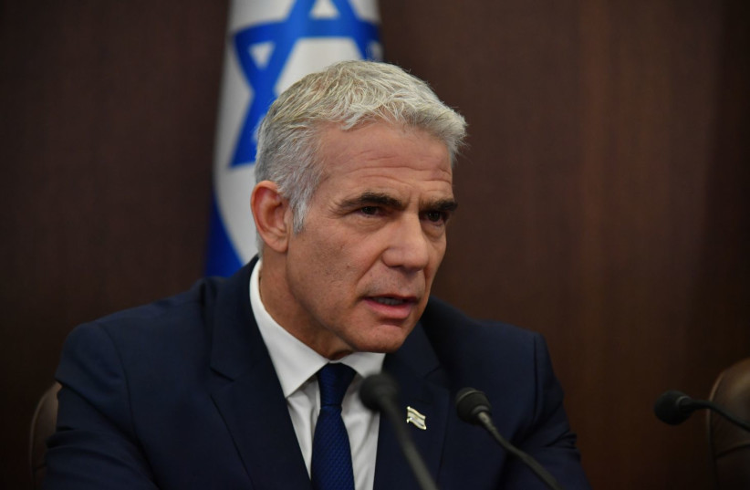 Prime Minister Yair Lapid at a weekly cabinet meeting, June 12, 2022 (photo credit: Yoav Dudkevitch/Pool)