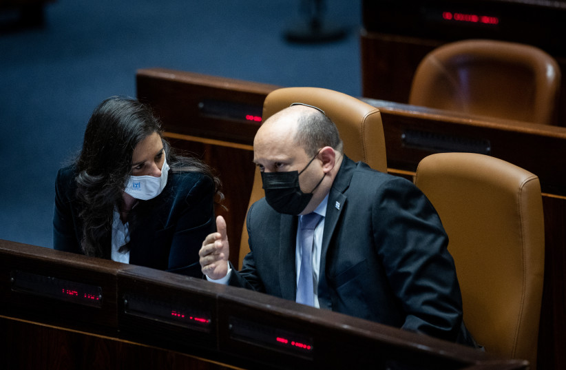 Israeli Prime Minister Naftali Bennett with Interior Minister Ayelet Shaked during a plenum session at the Knesset, the Israeli parliament in Jerusalem on February 28, 2022. (photo credit: YONATAN SINDEL/FLASH90)