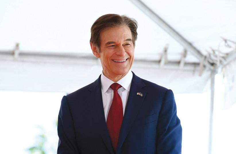  DR. MEHMET OZ smiles as he receives a star on the Hollywood Walk of Fame in February. (photo credit: JC Olivera/Getty Images/TNS)