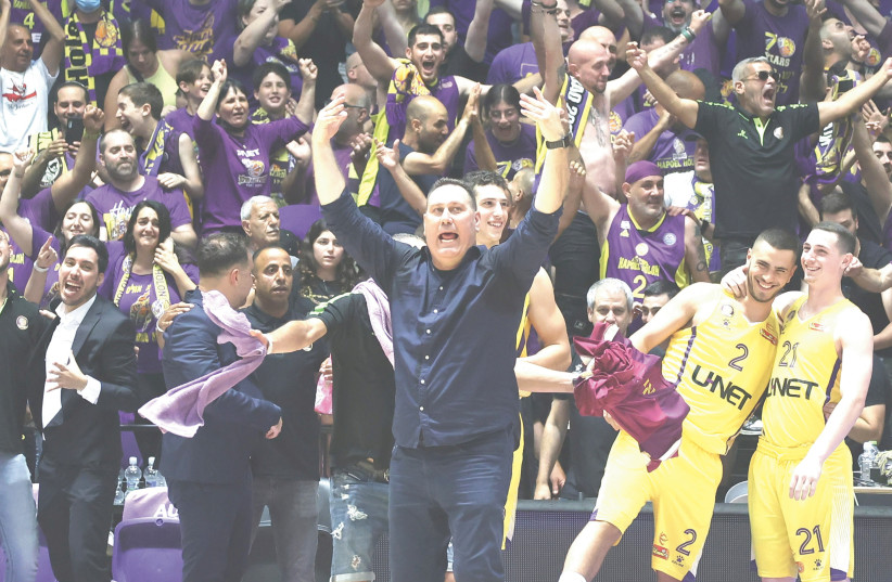  AFTER COMING to the club in the middle of the season, Guy Goodes (center) led Hapoel Holon to a resurgence, both in Europe and domestically.  (photo credit: DANNY MARON)