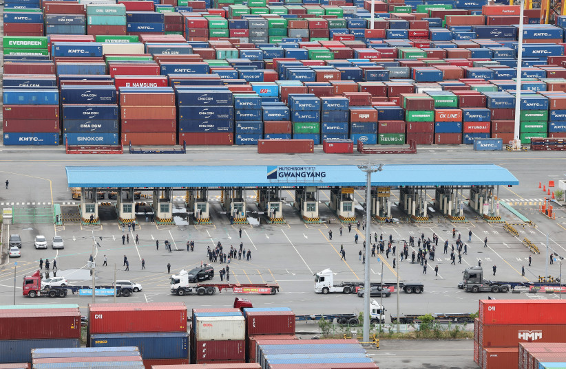 Members of the Cargo Truckers Solidarity union gather in front of Gwangyang port, in Gwangyang (photo credit: REUTERS)