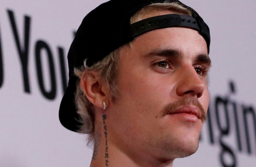  Singer Justin Bieber poses at the premiere for the documentary television series "Justin Bieber: Seasons" in Los Angeles, California, U.S., January 27, 2020. (photo credit: REUTERS/MARIO ANZUONI)