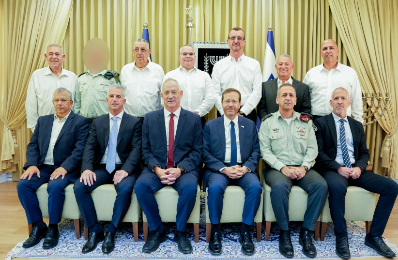  President Isaac Herzog and Defense Minister Benny Gantz with the winners of the defense award. (credit: DEFENSE MINISTRY PRESS OFFICE)
