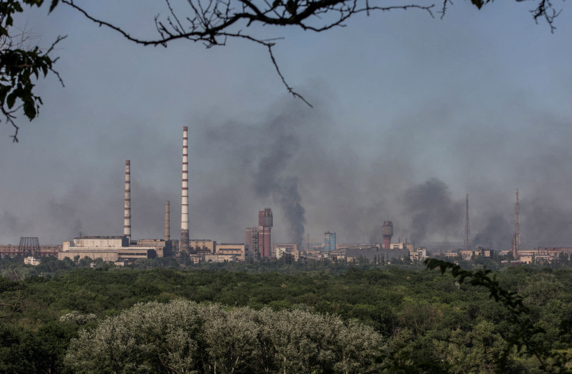  Smoke rises after a military strike on a compound of Sievierodonetsk's Azot Chemical Plant (photo credit: REUTERS)