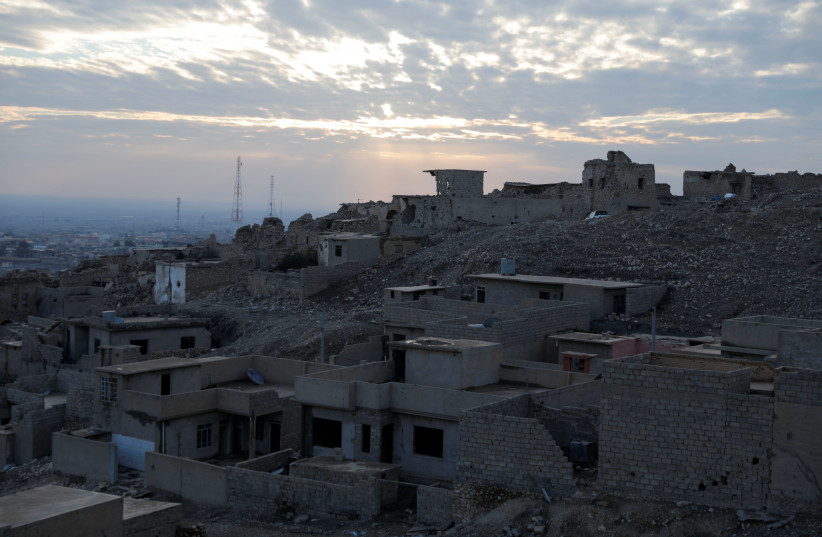 A view shows houses destroyed in past Islamic State militant attacks, in the town of Sinjar, Iraq January 24, 2022. Picture taken January 24, 2022. (credit: REUTERS/KHALID AL-MOUSILY)
