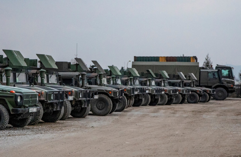  Army trucks are parked after the arrival of new EUFOR troops in Sarajevo, Bosnia and Herzegovina March 5, 2022. (credit: EUFOR/Rafael Schicher/Handout via REUTERS )