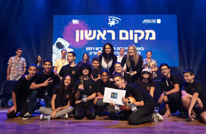  Israeli students are seen being awarded top prize at the eighth annual Israel Space Olympics in Jerusalem, on June 14, 2022.  (photo credit: DANA BAR SIMAN TOV)