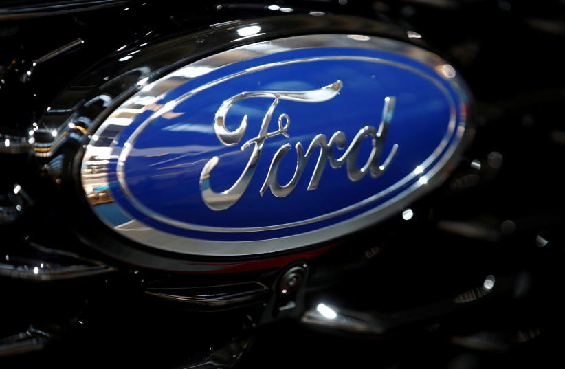 The Ford logo is pictured at the 2019 Frankfurt Motor Show (IAA) in Frankfurt, Germany.  (photo credit: REUTERS/Wolfgang Rattay/File Photo)