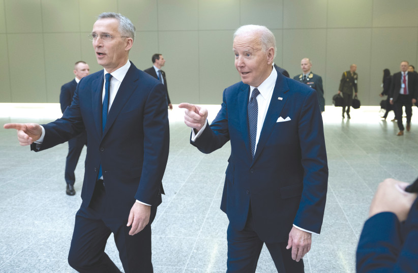  NATO SECRETARY GENERAL Jens Stoltenberg walks with US President Joe Biden at a summit at NATO Headquarters in Brussels, in March. (photo credit: Brendan Smialowski/Reuters)