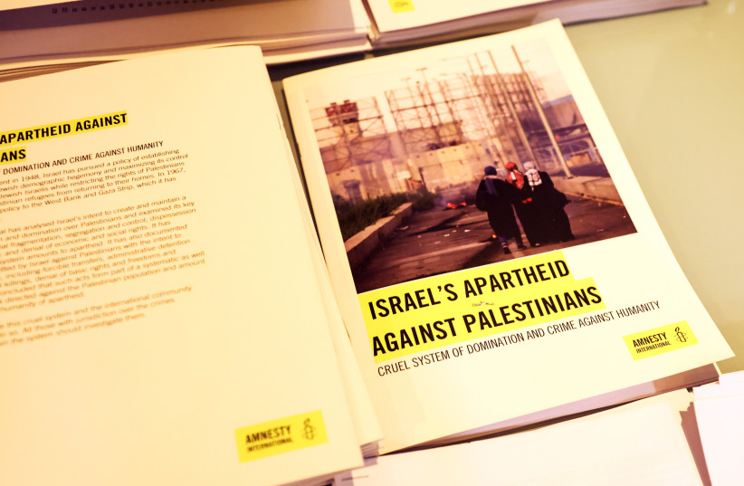  Copies of Amnesty International's report named ''Israel's Apartheid Against Palestinians: Cruel System of Domination and Crime Against Humanity'' are seen at a press conference at the St George Hotel, in East Jerusalem, February 1, 2022. (credit: RONEN ZVULUN/REUTERS)