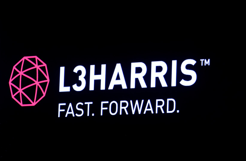 The logo of L3Harris is displayed on a screen on the floor of the New York Stock Exchange (NYSE) in New York, US, July 1, 2019. (photo credit: REUTERS/BRENDAN MCDERMID)