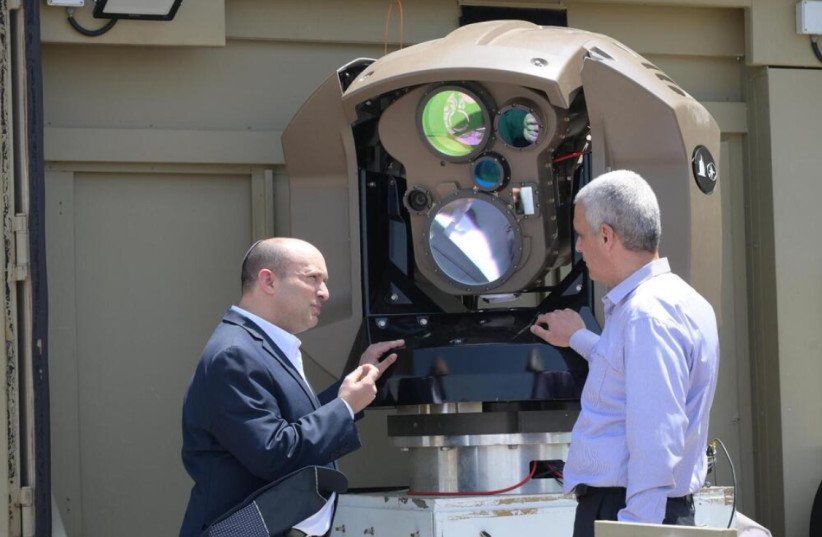 Naftali Bennett visits Rafael Advanced Defense Systems in January to inspect the new laser defense system.  (photo credit: AMOS BEN-GERSHOM/GPO)