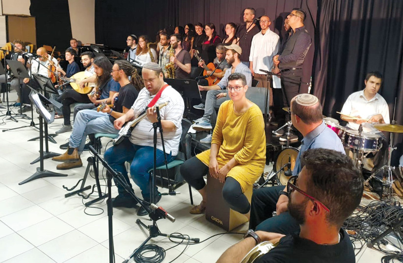  At a June 2021 concert by the Israel Integrative Orchestra, which includes both SHEKEL and Jerusalem Academy musicians (credit: SHEKEL)