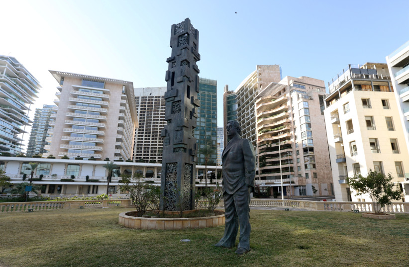 A statue of Lebanon's assassinated former prime minister Rafik al-Hariri is seen near the site of the suicide bombing that killed him in 2005, during the 16th anniversary of his assassination, in Beirut, Lebanon February 14, 2021. (photo credit: REUTERS/AZIZ TAHER)