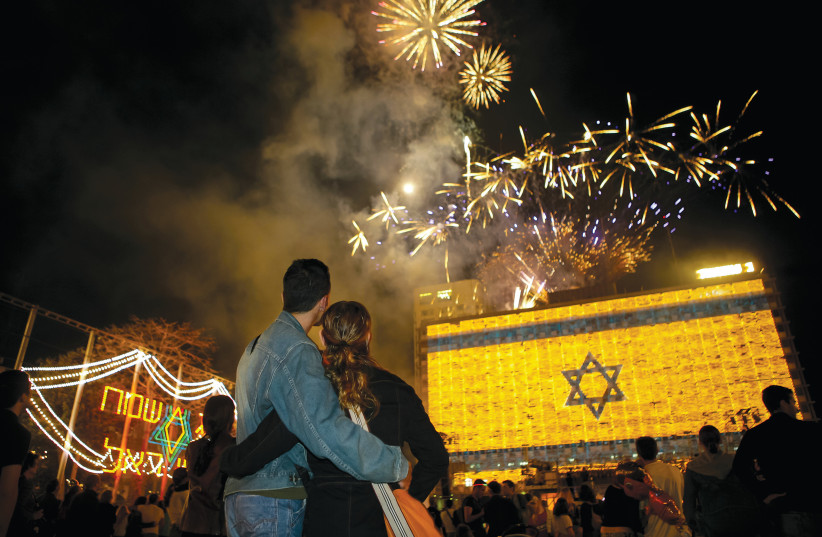  Ibn Gavirol Street: Fireworks at Tel Aviv City Hall and Rabin Square for Israel’s Independence Day. The street is named after the medieval Hebrew poet and philosopher Solomon Ibn Gavirol.  (credit: ZIV KOREN)