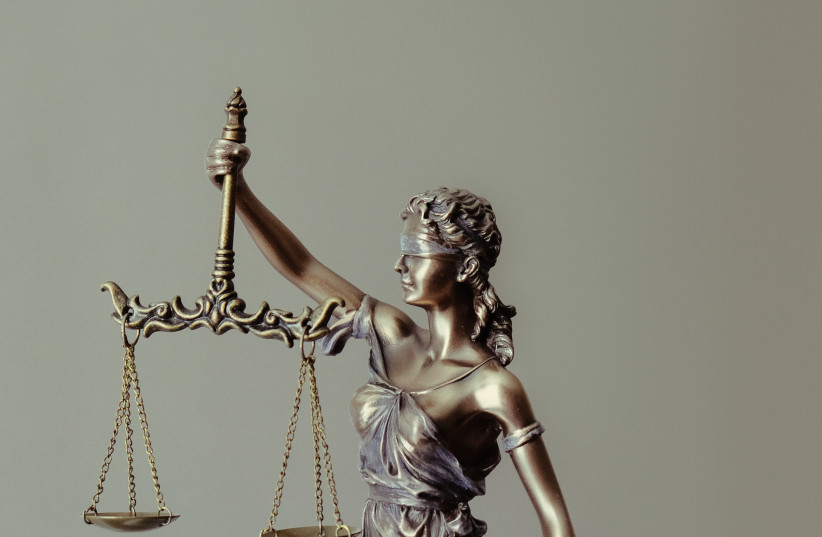  LADY JUSTICE: I tried to understand why this court case became such an obsession for half of the world. (photo credit: Tingey Injury Law Firm/Unsplash)