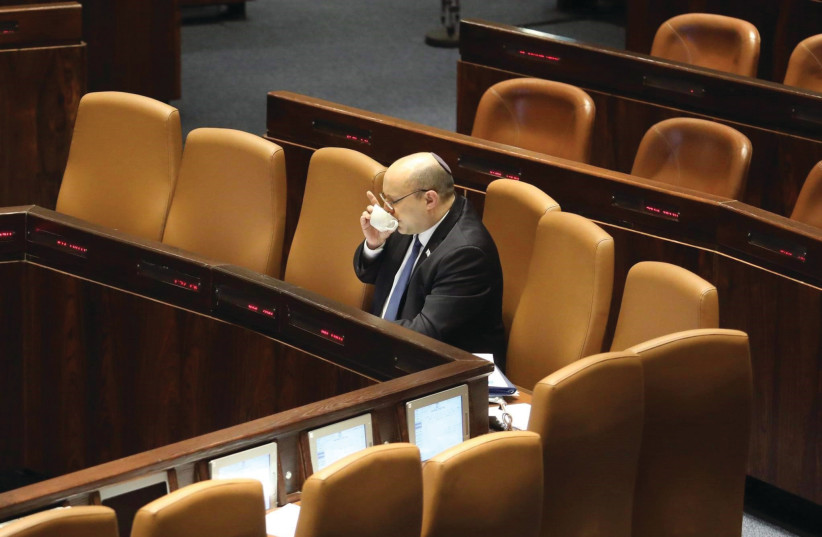  All alone and likely on his way out. Prime Minister Naftali Bennett in the Knesset this week. (photo credit: MARC ISRAEL SELLEM/THE JERUSALEM POST)