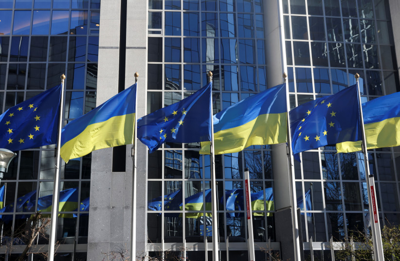  Flags of European Union and Ukraine flutter outside EU Parliament building, in Brussels, Belgium, February 28, 2022 (credit: REUTERS/YVES HERMAN)