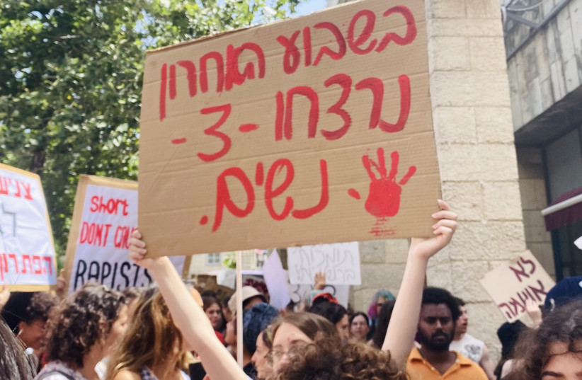  A sign reading ''in the last week, three women have been murdered,'' seen at Jerusalem SlutWalk, June 17, 2022 (credit: Shira Silkoff)