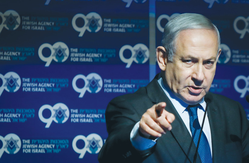 THEN-PRIME MINISTER Benjamin Netanyahu speaks at the annual Jewish Agency Board of Governors meeting in Jerusalem, in 2019. (photo credit: NOAM REVKIN FENTON/FLASH90)