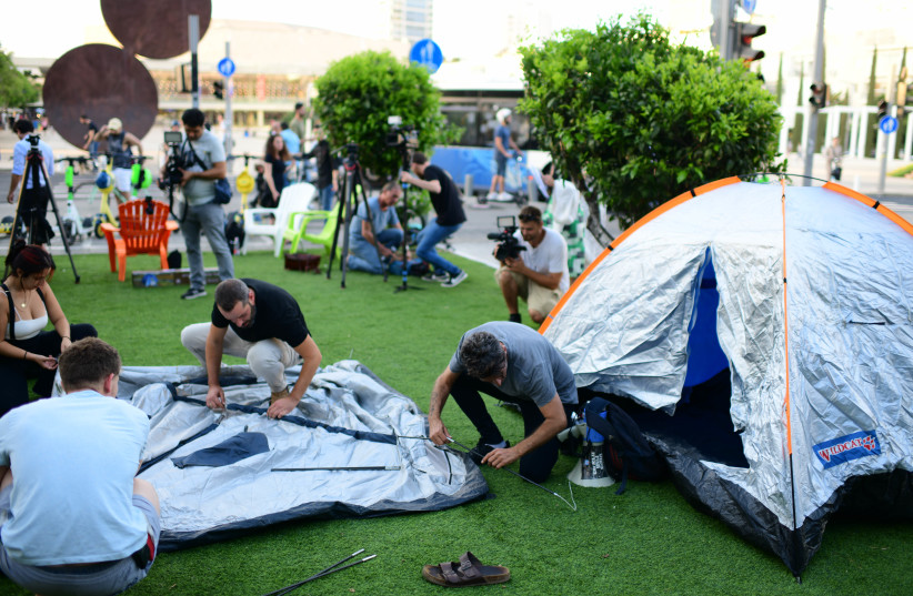  Israelis set up tents on Rothschild Boulevard in Tel Aviv, to protest against the soaring housing prices in Israel and social inequalities, on June 19, 2022.  (credit: TOMER NEUBERG/FLASH90)