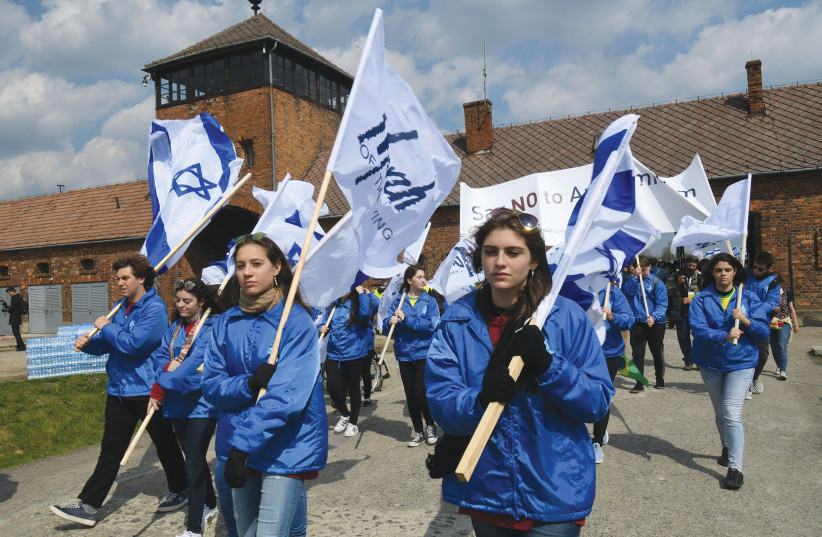  PARTICIPANTS IN the March of the Living at Auschwitz-Birkenau, May 2019: The educational and emotional benefits of a well-designed visit to Poland can be huge, says the writer.  (photo credit: YOSSI ZELIGER/FLASH90)