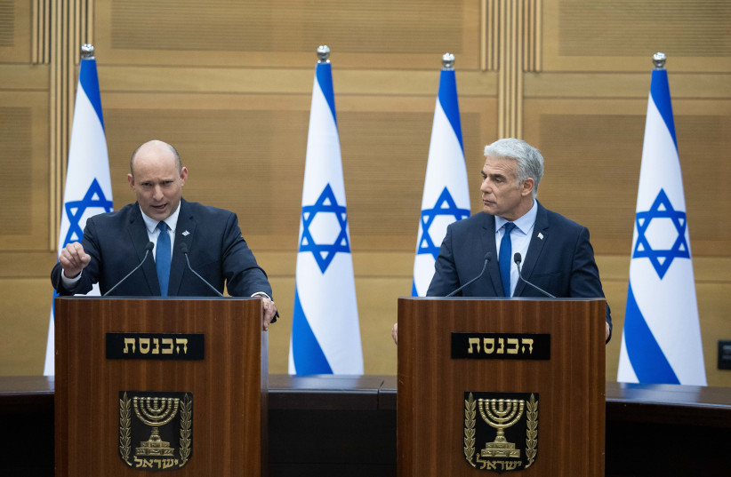  Israeli prime minister Naftali Bennett and Foreign Minister Yair Lapid hold a joint press conference at the Israeli parliament in Jerusalem on June 20, 2022.  (credit: YONATAN SINDEL/FLASH90)