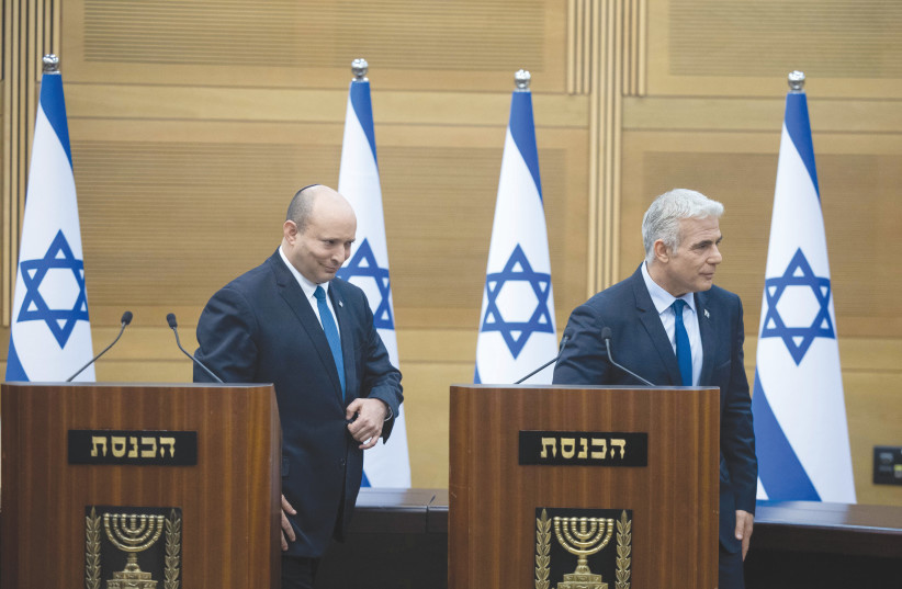  PRIME MINISTER Naftali Bennett and Foreign Minister Yair Lapid leave at the conclusion of their news conference, Monday at the Knesset. As Israelis brace for a third prime minister in barely a year, let’s say it loud and clear: ‘thank you Naftali Bennett,’ says the writer (photo credit: YONATAN SINDEL/FLASH90)
