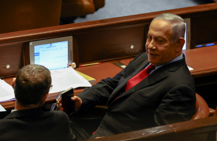 Benjamin Netanyahu is seen at a preliminary reading at the Knesset of a bill to dissolve the parliament after Prime Minister Naftali Bennett and Foreign Minister Yair Lapid moved to disband their government and hold elections, in Jerusalem, June 22, 2022. (credit: RONEN ZVULUN/REUTERS)