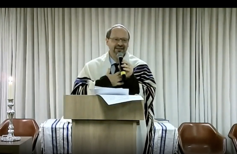 Rabbi Uri Lam leads a Jewish mourning ceremony including the names of the two men killed while working on reports about threats to indigenous communities.  (photo credit: screenshot)
