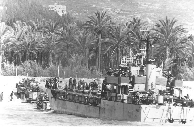  ISRAELI ARMORED vehicles disembark from a landing craft during an amphibious landing. (credit: Wikimedia Commons)