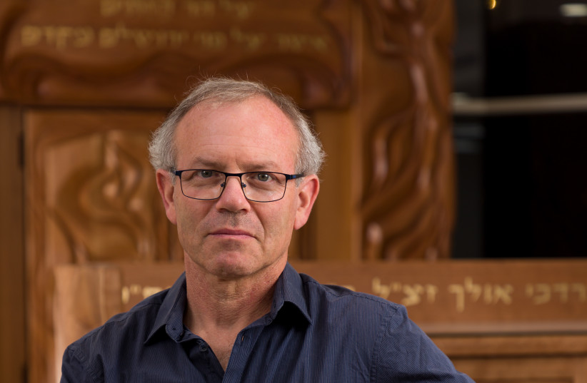  Jeremy Kimchi in front of the ‘Return to the Mount of Olives’ Torah Ark and bimah, at Ma’aleh Hazeitim, Jerusalem. (credit: Udi Katzman)