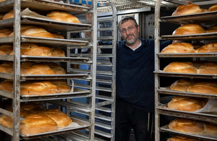  HUNDREDS OF loaves of challah in Elkins Park, Pennsylvania, last year for use on Shabbat and Jewish holidays. The book delves into new understandings of the Sabbath in contemporary times. (photo credit: RACHEL WISNIEWSKI/REUTERS)
