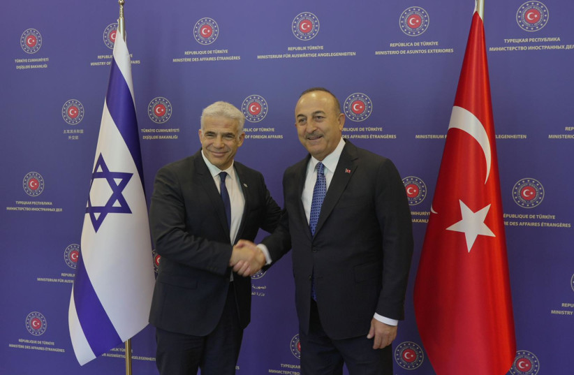  Foreign Minister Yair Lapid meets with Turkish Foreign Minister Mevlut Cavusoglu (credit: BOAZ OPPENHEIM/GPO)