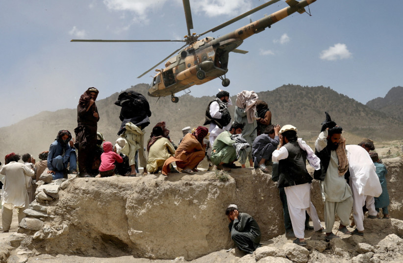 A Taliban helicopter takes off after bringing aid to the site of an earthquake in Gayan, Afghanistan, June 23, 2022. (credit:  REUTERS/ALI KHARA)