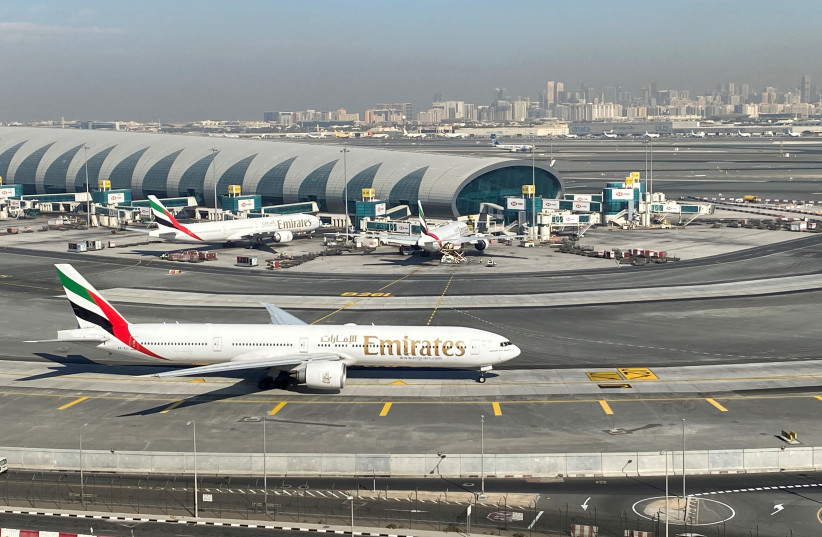 Emirates airliners are seen on the tarmac in a general view of Dubai International Airport in Dubai, United Arab Emirates, January 13, 2021. (credit: REUTERS/ABDEL HADI RAMAHI/FILE PHOTO)