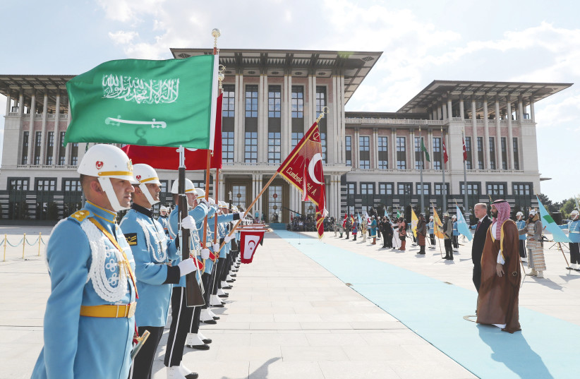  TURKISH PRESIDENT Tayyip Erdogan and Saudi Crown Prince Mohammed bin Salman review a guard of honour during a welcoming ceremony at the Presidential Palace in Ankara, Wednesday.  (photo credit: Murat Cetinmuhurdar/PPO/Reuters)