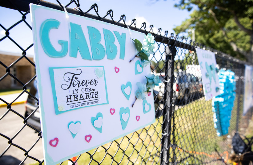  A sign is seen during Gabby Petito's memorial service in Holbrook, New York, US, September 26, 2021. (credit: REUTERS/JEENAH MOON)