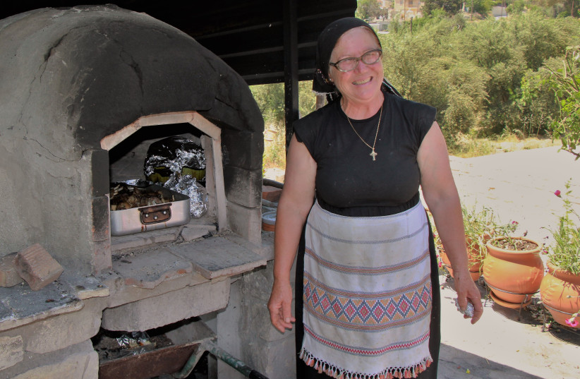  Sophia Kyriakou prepares ''Kleftiko'' meat stew at her home restaurant ''Sofia's House'' in the village of Letymbou near Paphos. (credit: ORI LEWIS)