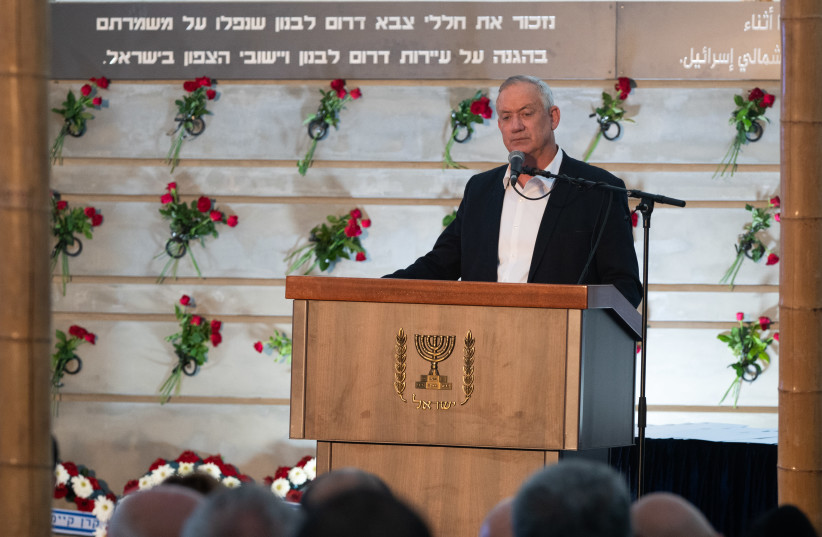  Defense Minister Benny Gantz speaks during a ceremony for a new monument in memory of fallen soldiers of the South Lebanon Army (SLA), in Metula, northern Israel, July 4, 2021 (credit: BASEL AWIDAT/FLASH90)