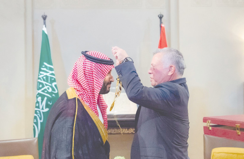  JORDAN’S KING ABDULLAH presents a necklace to Saudi Crown Prince Mohammed bin Salman, in Amman last week. During his upcoming Middle East trip, US President Joe Biden will try to reset the relationship with countries in the region. (photo credit: SAUDI PRESS AGENCY/REUTERS)