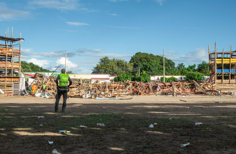 A police officer stands inside a bullring where some stands collapsed during the celebration of the San Pedro festivities, in El Espina, Colombia June 26, 2022. (credit: REUTERS/CRISTIAN PARRA)