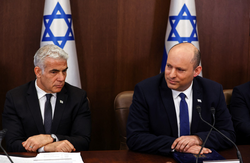  Israeli Prime Minister Naftali Bennett and Israeli Foreign Minister Yair Lapid attend a cabinet meeting at the Prime Minister's office in Jerusalem June 26, 2022 (credit: RONEN ZVULUN/REUTERS)