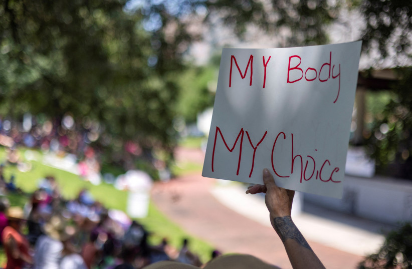  A protester holds a sign during nationwide demonstrations following the leaked Supreme Court opinion suggesting the possibility of overturning the Roe v. Wade abortion rights decision, at Duncan Plaza in New Orleans, Louisiana, US, May 14, 2022.  (credit: REUTERS/KATHLEEN FLYNN)