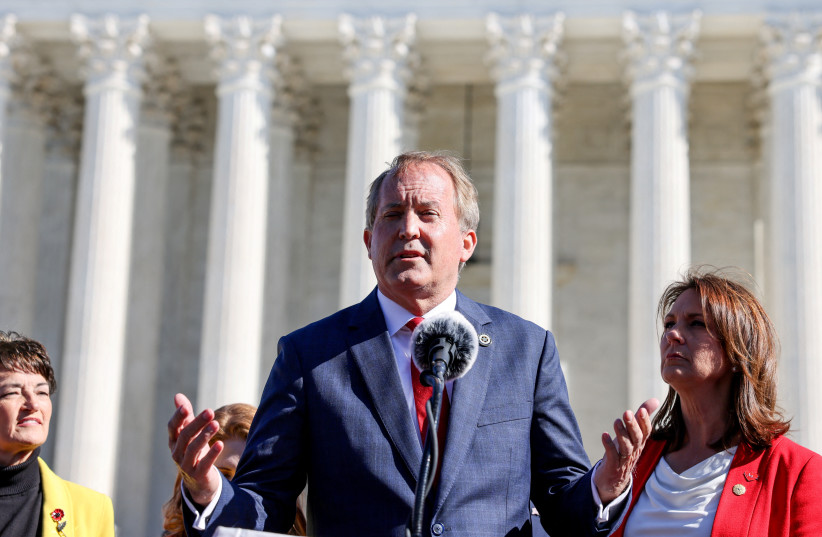 Texas Attorney General Ken Paxton speaks to anti-abortion supporters outside the US Supreme Court following arguments over a challenge to a Texas law that bans abortion after six weeks in Washington, US, November 1, 2021. (credit: REUTERS/Evelyn Hockstein/File Photo)